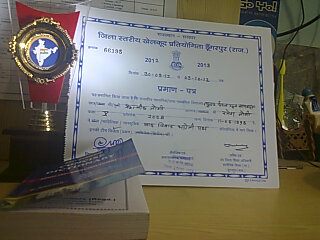 Ritwik Joshi holding a winning debate certificate