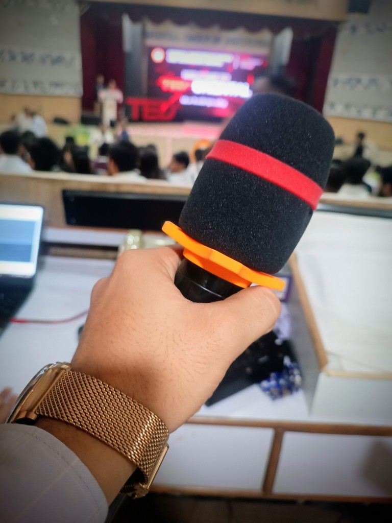 Close-up of the microphone set up for the audience Q&A session at the TEDxOIST event.